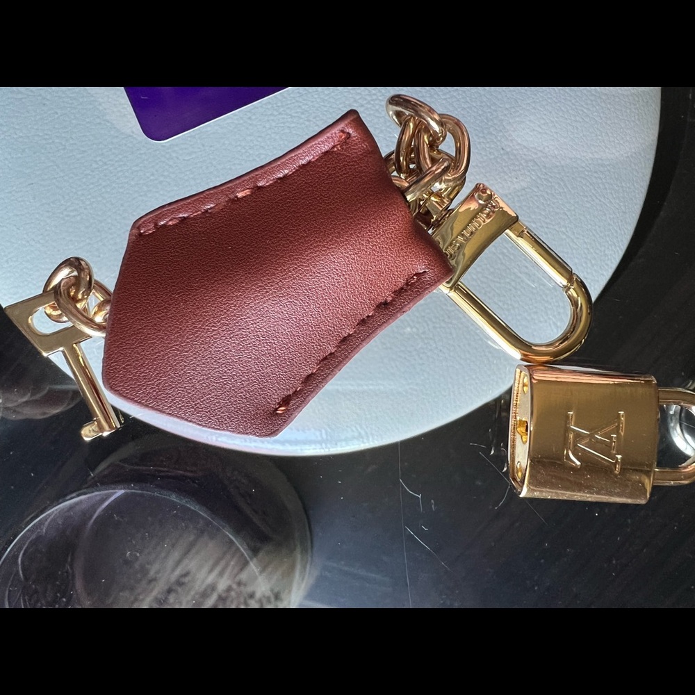 Louis Vuitton Lock with chain, key and pouch